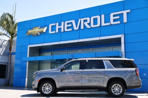 A Chevrolet Suburban displayed for sale at a Chevrolet dealership in 2021.