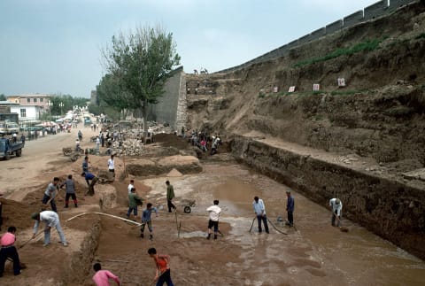 Workers restoring a segment of the Great Wall of China.