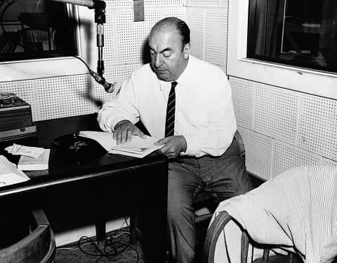 Pablo Neruda reads poetry in a recording studio.