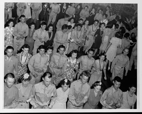 Japanese-American volunteer soldiers from the Rohwer War Relocation Center in Arkansas at a dance in 1944. George Takei's family was interned there.