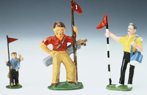 Lead golf caddy figures from the 1930s.