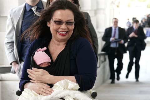 Duckworth with her daughter, Maile, after the Senate's new law passed. 