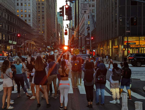 Manhattanhenge sunset on 42nd Street in New York City.