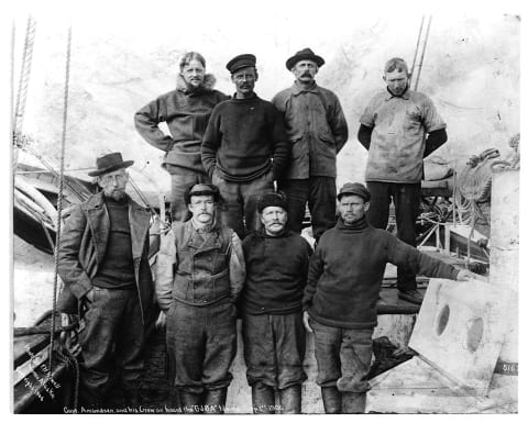 Amundsen (far left) and his crew on the 'Gjøa' in Nome, Alaska, after traversing the Northwest Passage.