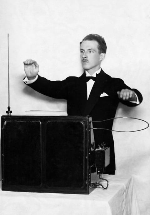 Leon Theremin playing his namesake instrument.