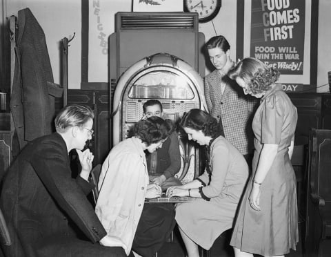 Women using a Ouija board circa 1940.