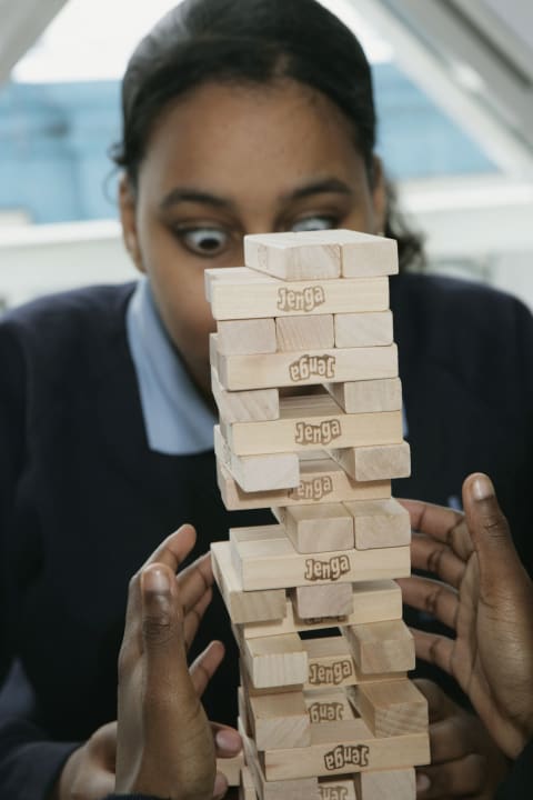 Playing Jenga.