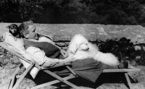 Gertrude Stein with a white poodle named Pepe.