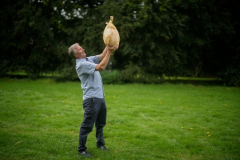 Gareth Griffin and his world record breaking onion, weighing in at 19.77 pounds during the Harrogate Autumn Flower Show at Newby Hall on September 15, 2023 in Ripon, England.