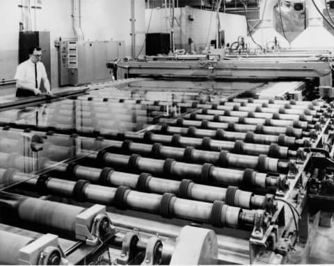 The process of making safety-glass windshields.