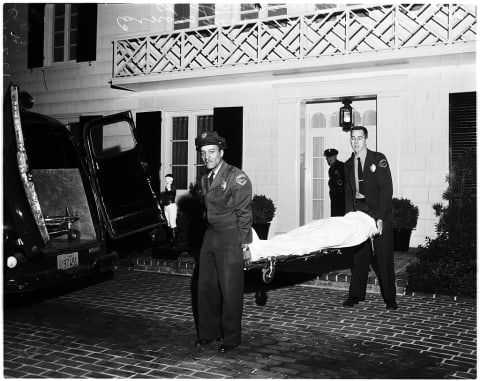 Johnny Stompanato’s body being removed from Turner’s home.