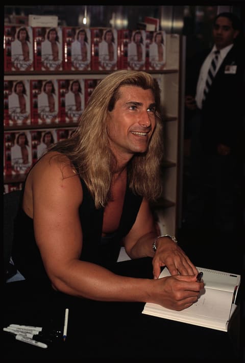 Fabio signs books for fans.