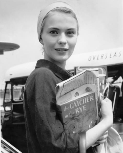 Actress Jean Seberg holds a copy of the reclusive author’s best-known work.