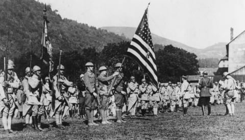 American soldiers in Alsace carrying their flag during WWI.