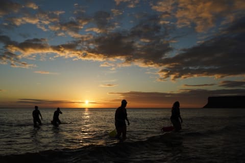 Beachgoers enjoying the summer solstice at Saltburn-by-the-Sea, England.