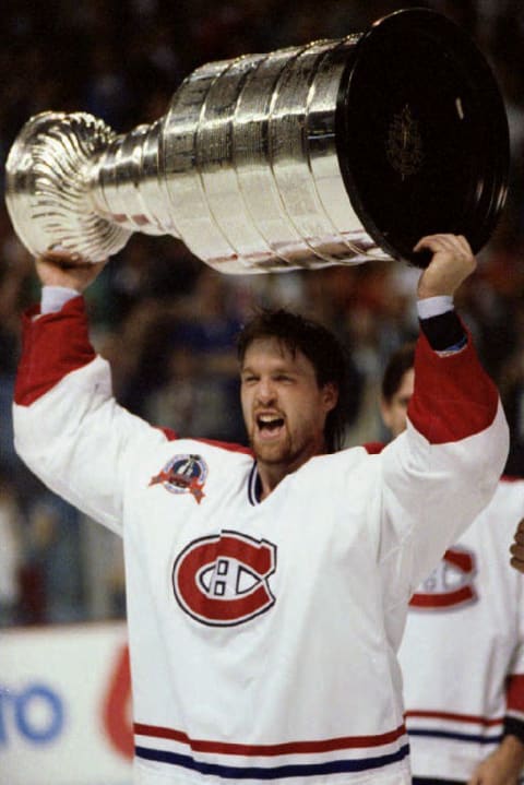 Patrick Roy of the Montreal Canadiens holds the cup over his head after Montreal defeated the Los Angeles Kings 4-1 on June 9, 1993.