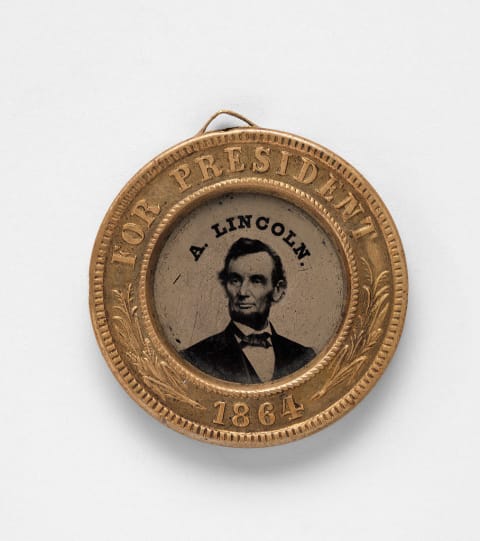 An 1864 presidential campaign medal with Abraham Lincoln's portrait.