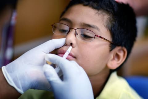 A boy in South Florida received an H1N1 influenza vaccine.