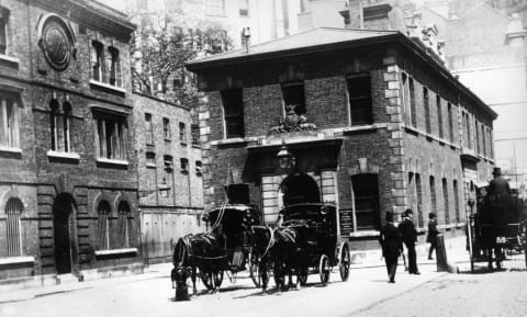 Scotland Yard (left) circa 1875.