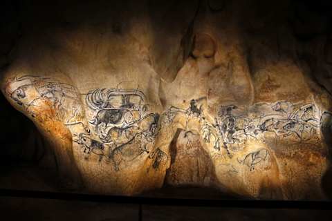 An exact replica of the menagerie of ice age animals depicted on a large wall inside Chauvet Cave.