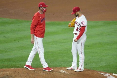 May 22, 2021; Anaheim, California, USA; Los Angeles Angels interim pitching coach Matt Wise (left)