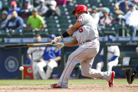 May 2, 2021; Seattle, Washington, USA; Los Angeles Angels first baseman Albert Pujols (5) loses his