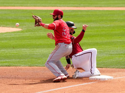 Mar 25, 2022; Scottsdale, Arizona, USA; Arizona Diamondbacks Christian Walker reaches third base; Michael Stefanic