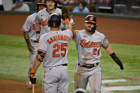 Apr 4, 2023; Arlington, Texas, USA; Baltimore Orioles designated hitter Anthony Santander (25) and Ryan McKenna high five