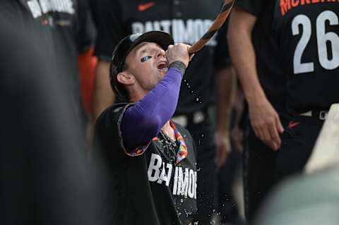 Jun 9, 2023; Baltimore, Maryland, USA;  Baltimore Orioles left fielder Austin Hays (21) drinks from the homer hose after hitting a home run