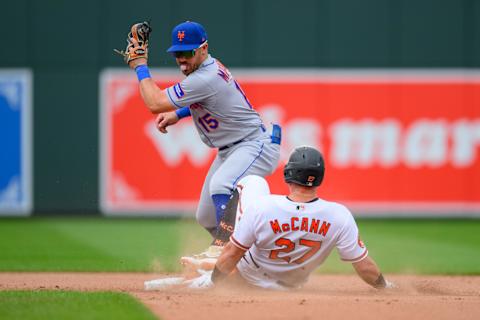 Aug 6, 2023; Baltimore, Maryland, USA; Baltimore Orioles catcher James McCann (27) reaches second base against the New York Mets