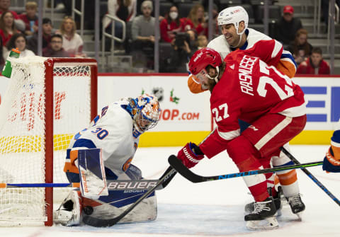 Dec 14, 2021; Detroit, Michigan, USA; Detroit Red Wings center Michael Rasmussen (27) takes a shot