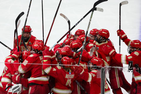 Apr 11, 2024; Saint Paul, Minnesota, USA; Denver Pioneers players celebrate forward Tristan Broz's