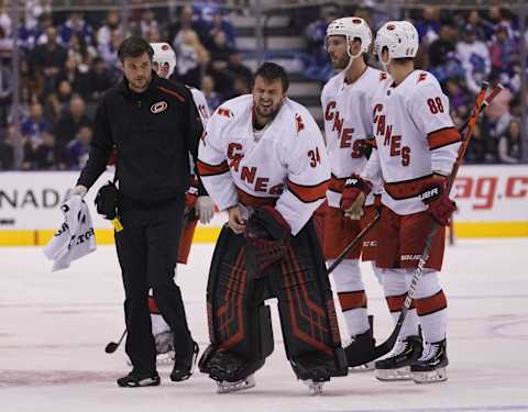 Feb 22, 2020; Toronto, Ontario, CAN; Carolina Hurricanes goaltender Petr Mrazek (34) comes off the ice after a collision with Toronto Maple Leafs forward Kyle Clifford (not pictured) during the second period at Scotiabank Arena. Mandatory Credit: John E. Sokolowski-USA TODAY Sports