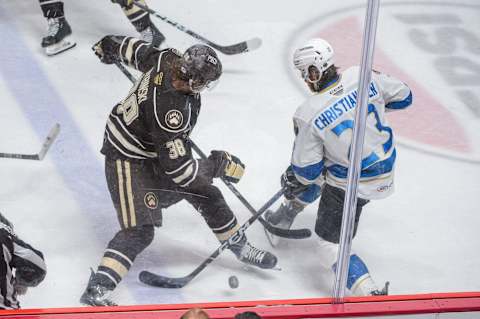 Hershey Bears' Henrik Rybinski (38) competes with Cleveland Monsters' Jake Christiansen (23) during the decisive game 7 of the AHL Eastern Conference Finals between the Hershey Bears and Cleveland Monsters on Wednesday, June 12, 2024, at the Giant Center in Hershey. The Bears won, 3-2, in overtime.