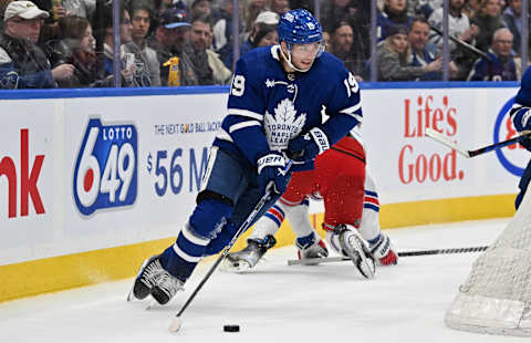 Mar 2, 2024; Toronto, Ontario, CAN;  Toronto Maple Leafs forward Calle Jarnkrok (19) skates with the puck against the New York Rangers in overtime at Scotiabank Arena. Mandatory Credit: Dan Hamilton-Imagn Images