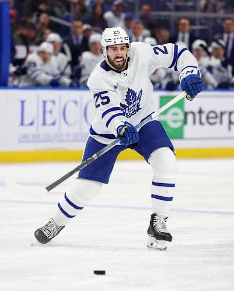 Mar 30, 2024; Buffalo, New York, USA;  Toronto Maple Leafs defenseman Conor Timmins (25) makes a pass during the third period against the Buffalo Sabres at KeyBank Center. Mandatory Credit: Timothy T. Ludwig-Imagn Images