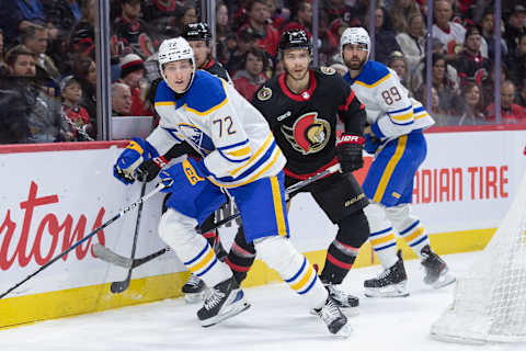 Dec 31, 2023; Ottawa, Ontario, CAN; Buffalo Sabres center Tage Thopson (72) and Ottawa Senators