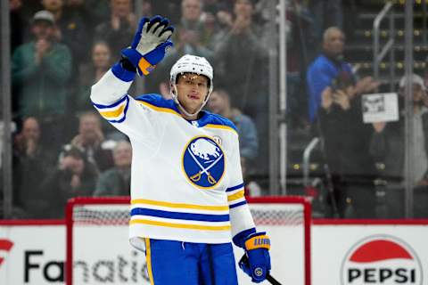 Dec 13, 2023; Denver, Colorado, USA; Buffalo Sabres defenseman Erik Johnson (6) waves to the