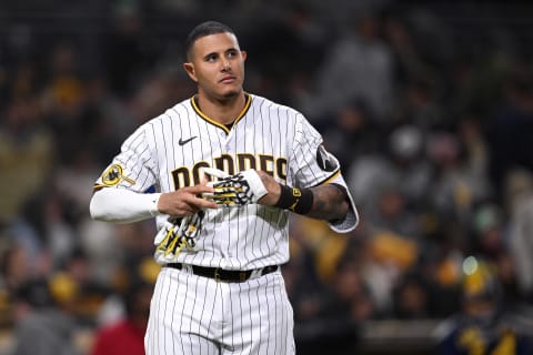 Apr 13, 2023; San Diego, California, USA; San Diego Padres third baseman Manny Machado (13) removes