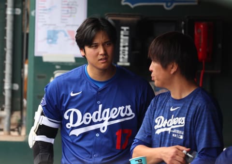 Mar 12, 2024; Phoenix, Arizona, USA; Los Angeles Dodgers designated hitter Shohei Ohtani talks with his former interpreter Ippei Mizuhara.