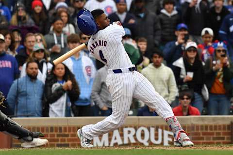 Apr 20, 2024; Chicago, Illinois, USA; Chicago Cubs left fielder Alexander Canario (4) strikes out swinging during the ninth inning against the Miami Marlins at Wrigley Field. Mandatory Credit: Patrick Gorski-Imagn Images