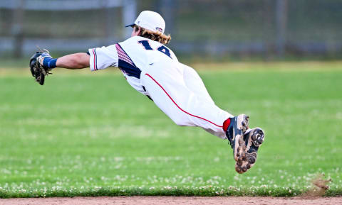 ORLEANS 7/01/22  Y-D second baseman Chase Meidroth  makes a flying stop on ball hit by Austin Knight