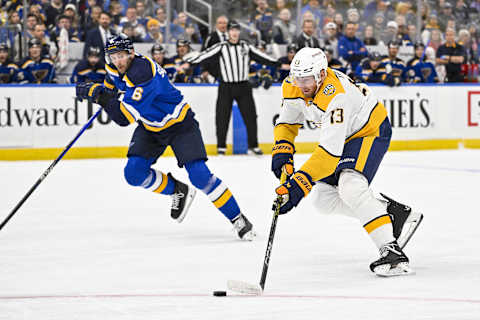 Nov 24, 2023; St. Louis, Missouri, USA;  Nashville Predators center Yakov Trenin (13) controls the