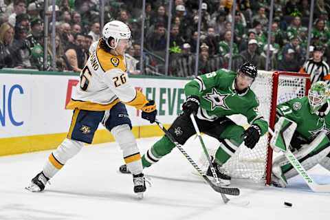 Jan 6, 2024; Dallas, Texas, USA; Nashville Predators center Philip Tomasino (26) passes the puck in