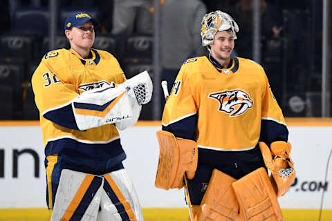 Mar 23, 2024; Nashville, Tennessee, USA; Nashville Predators goaltender Kevin Lankinen (32) and