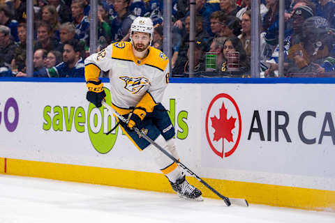 Apr 23, 2024; Vancouver, British Columbia, CAN; Nashville Predators forward Tommy Novak (82) handles the puck against the Vancouver Canucks during the first period in game two of the first round of the 2024 Stanley Cup Playoffs at Rogers Arena. Mandatory Credit: Bob Frid-USA TODAY Sports