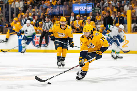 May 3, 2024; Nashville, Tennessee, USA; Nashville Predators right wing Luke Evangelista (77) skates with the puck against the Vancouver Canucks during the first period in game six of the first round of the 2024 Stanley Cup Playoffs at Bridgestone Arena. Mandatory Credit: Steve Roberts-USA TODAY Sports