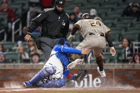 Atlanta Braves catcher Travis d'Arnaud was placed on the seven-day concussion list after this collision with San Diego outfielder Rougned Odor.