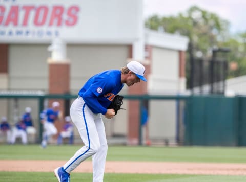 Gators pitcher Hurston Waldrep (12) reacts to striking out the Huskies in the top of the fifth