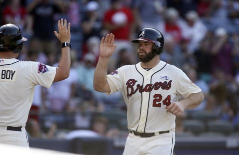 Aug 31, 2014; Atlanta, GA, USA; Atlanta Braves catcher Evan Gattis (24) celebrates his solo home run